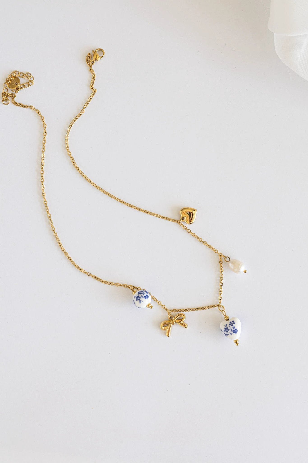 Bella Charm Necklace in Blue by Rose & Clay