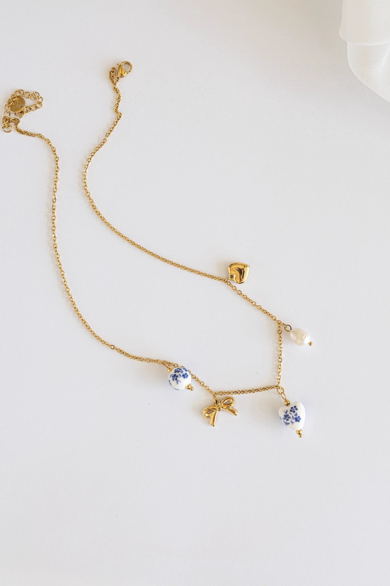 Bella Charm Necklace in Blue by Rose & Clay