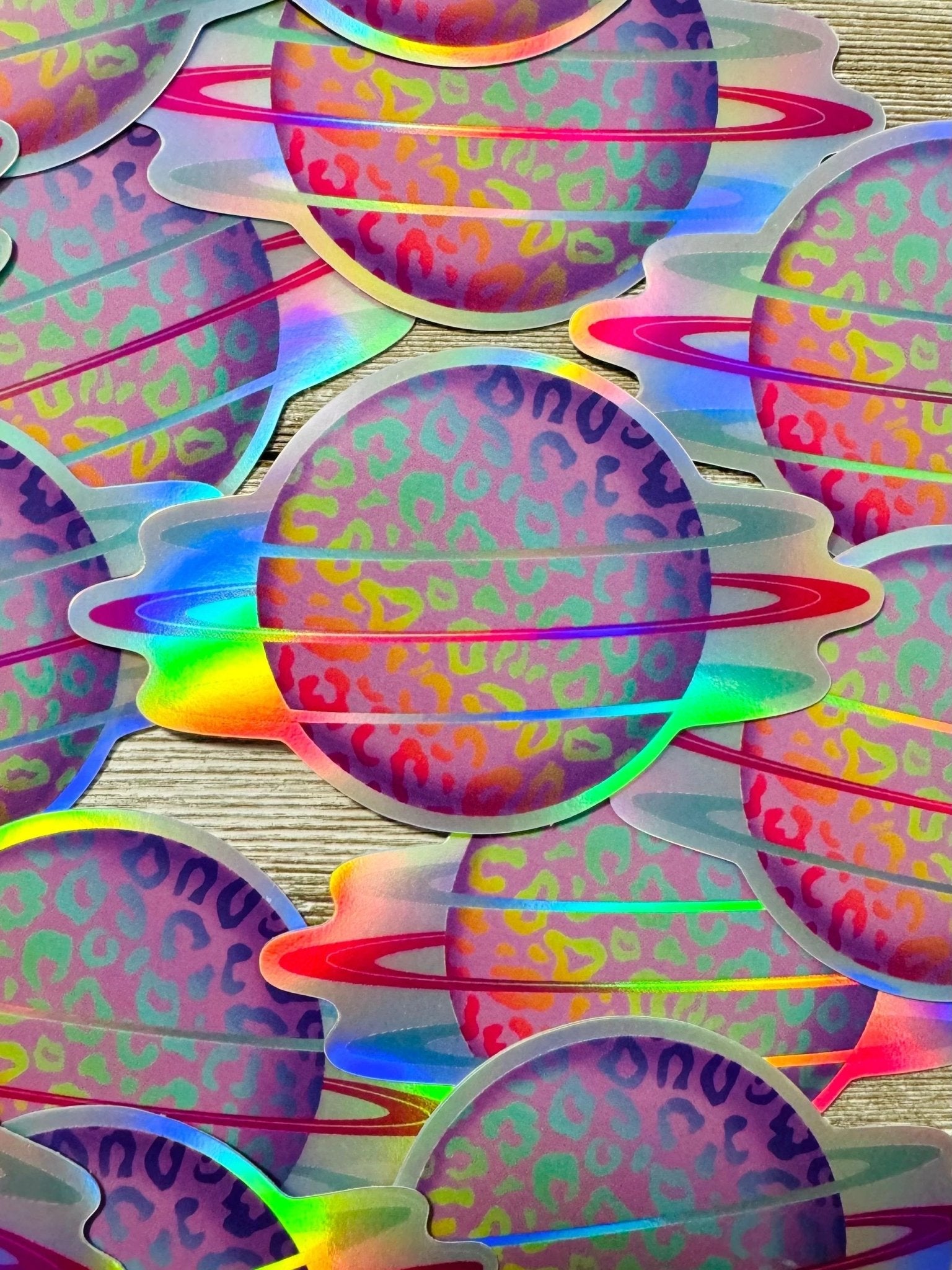 Bespattered Facade Holographic Rainbow Leopard Print Planet Sticker by Bespattered Facade