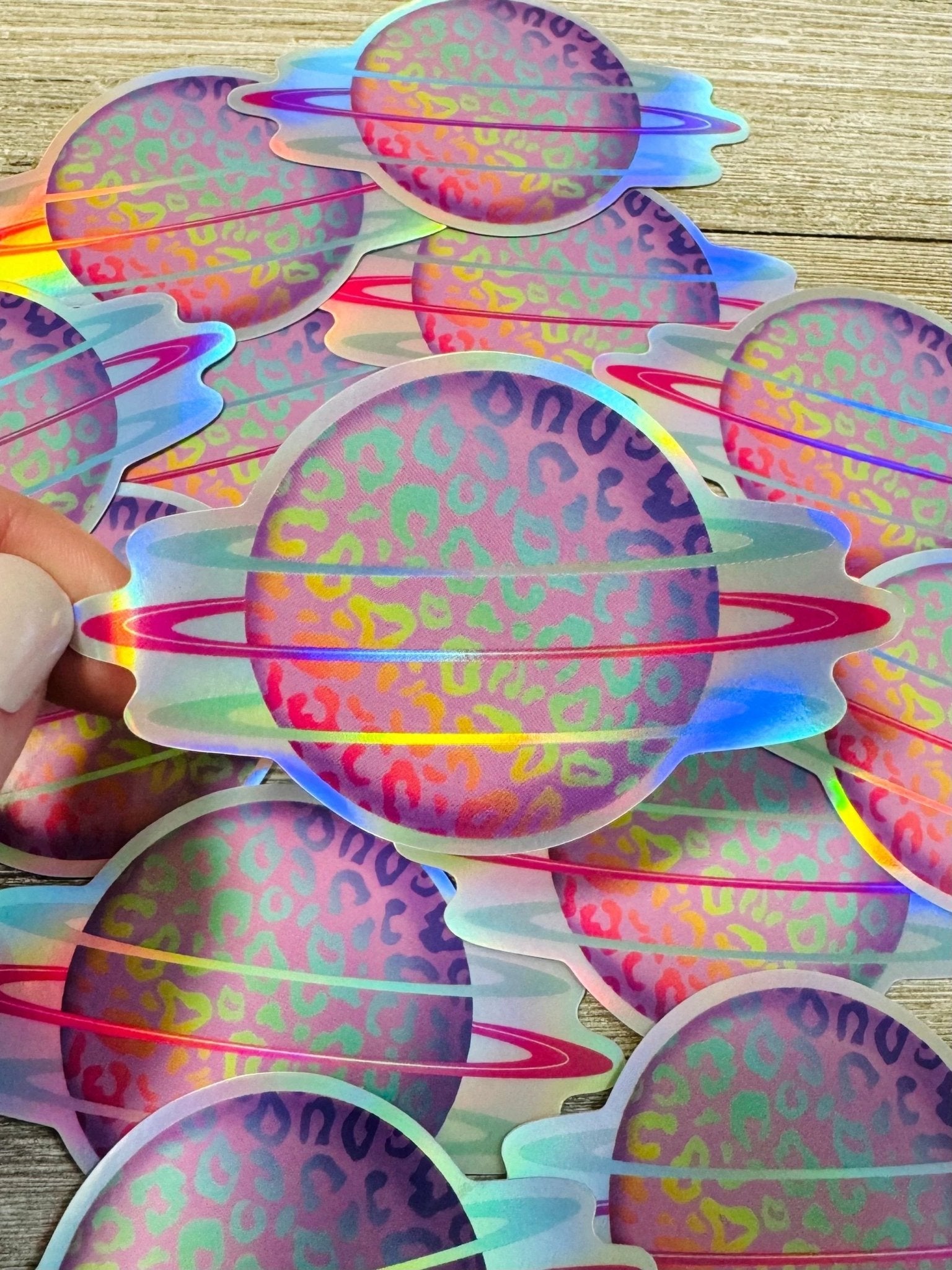 Bespattered Facade Holographic Rainbow Leopard Print Planet Sticker by Bespattered Facade