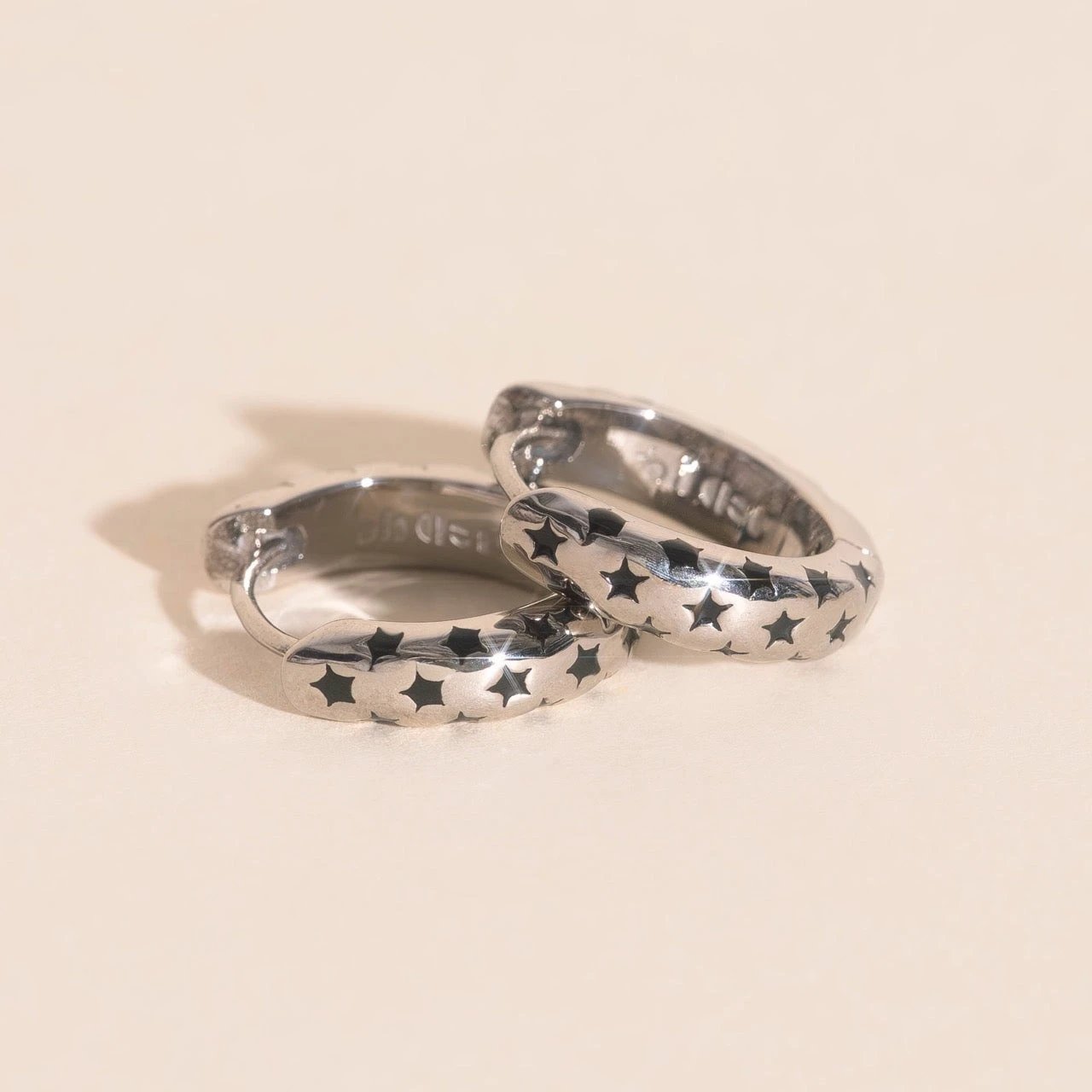 Black Star Chunky Huggie Hoop Earrings by Oh Clementine