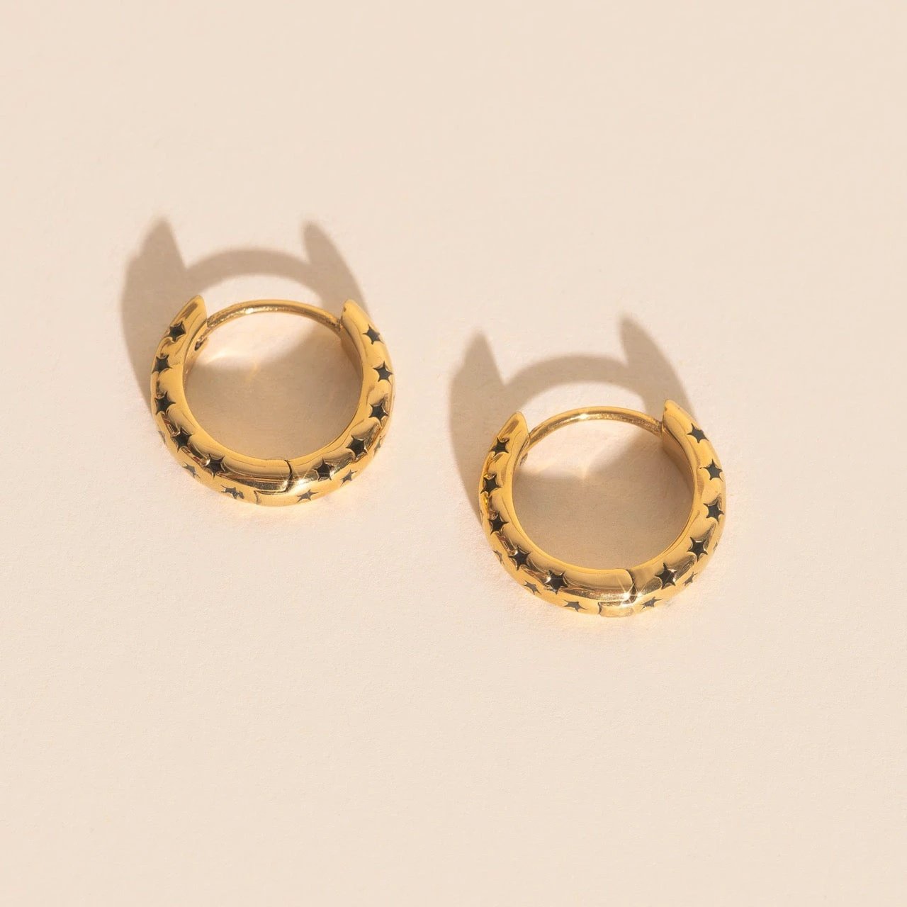 Black Star Chunky Huggie Hoop Earrings by Oh Clementine