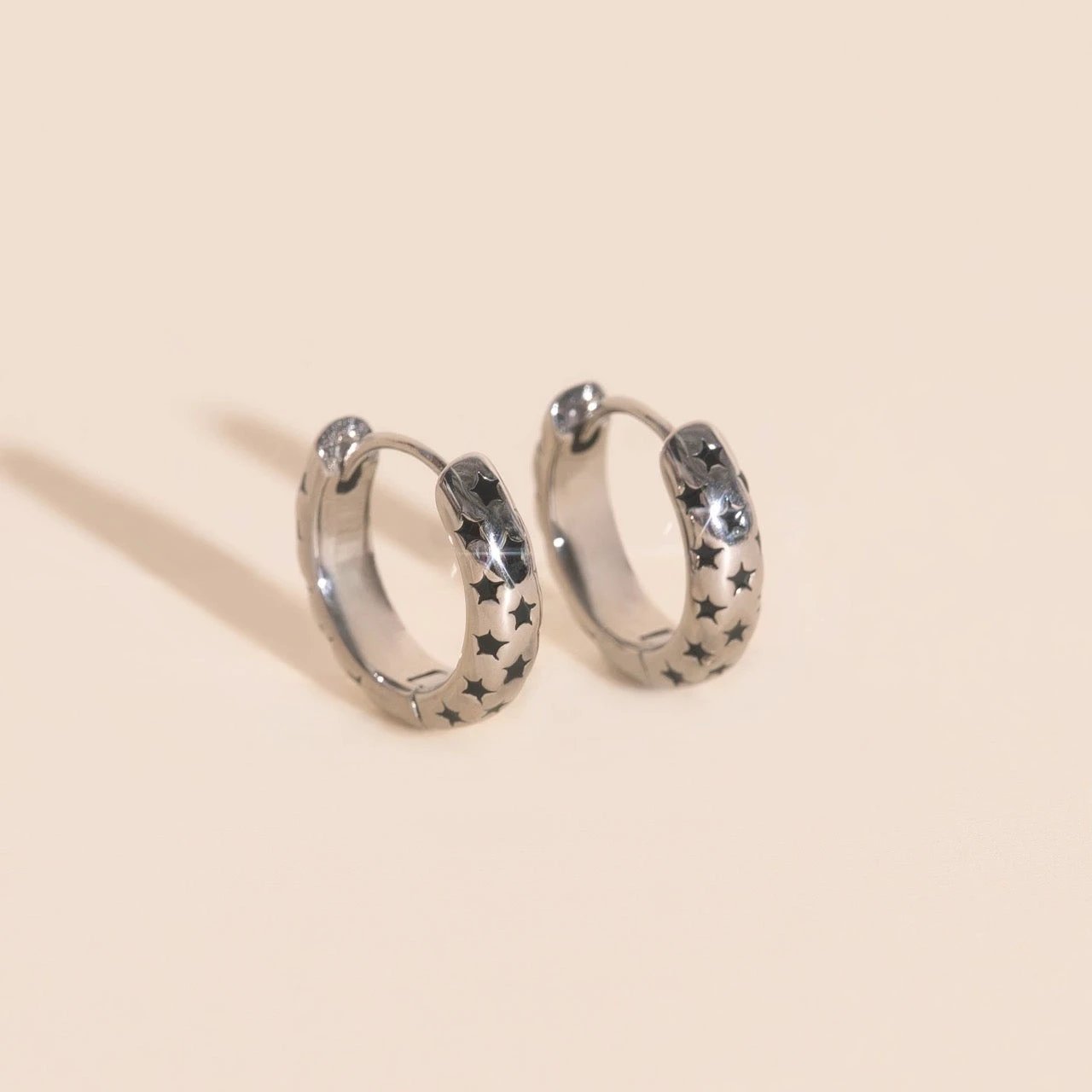 Black Star Chunky Huggie Hoop Earrings by Oh Clementine