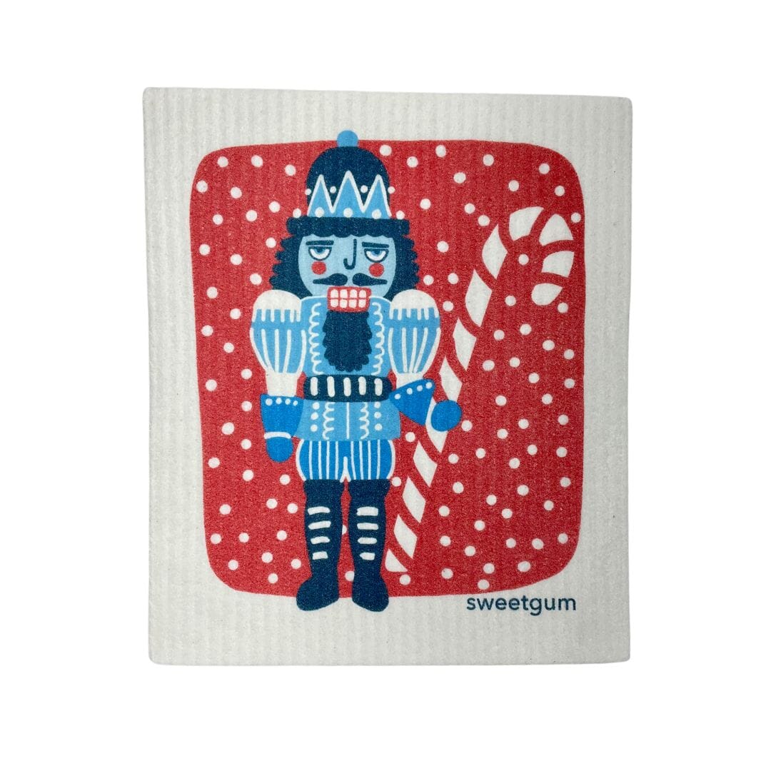 Blue Nutcracker Swedish Dishcloth | Red background with snow Swedish Dishcloths La Vie Bien Blue Nutcracker Swedish Dishcloth | Red background with snow