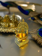 Brass Laxmi Diya with Peacock on Sides Diyas & Samai La Vie Bien Brass Laxmi Diya with Peacock on Sides