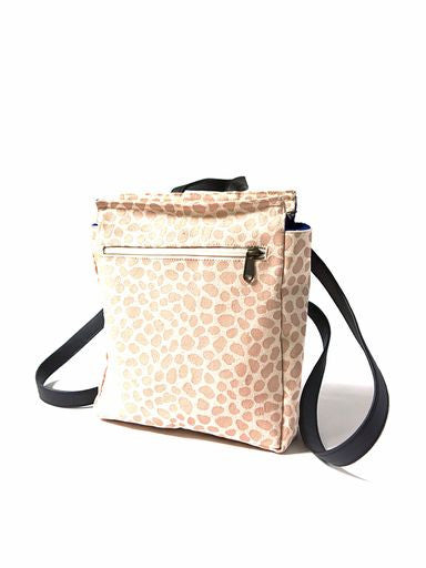 Crossbody bag with a leopard print pattern on a white background