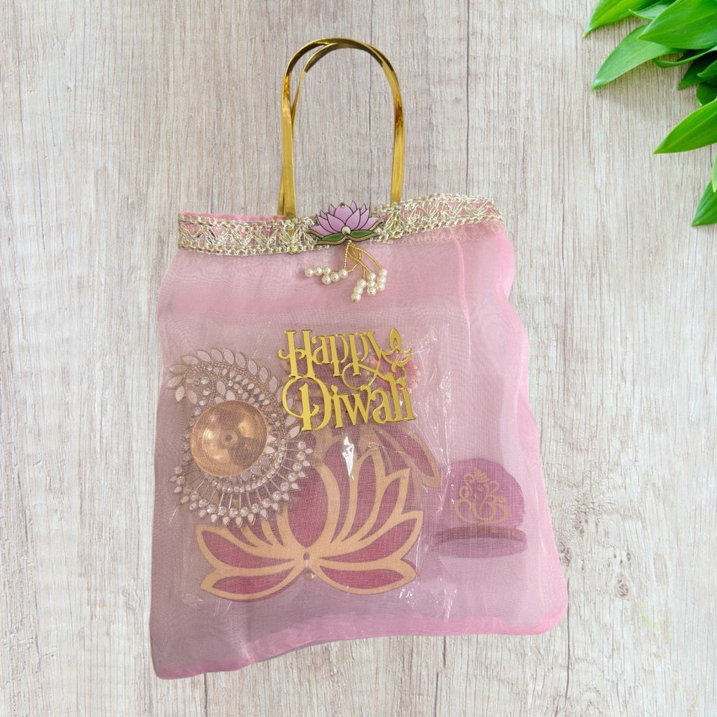 Combo of Akhand Diya, Resin Ganesha, Lotus Hanging in Organza Bag La Vie Bien Combo of Akhand Diya, Resin Ganesha, Lotus Hanging in Organza Bag