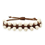 Cord of 3 cream howlite and brown cord adjustable bracelet by Alegria Accessories Inc