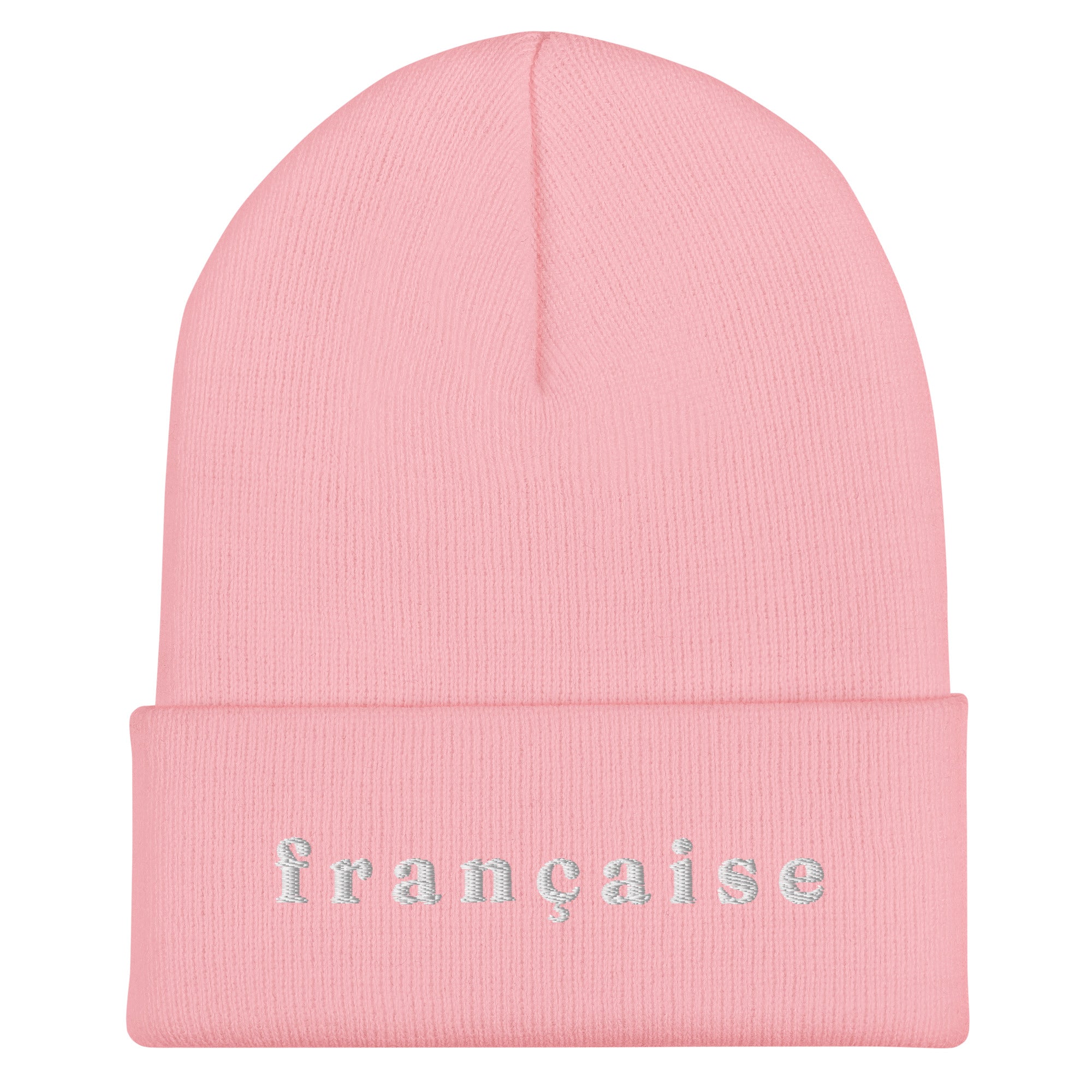 Light pink knit cuffed beanie with white embroidered text "française" in lowercase serif font