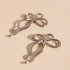 Dainty Bow Huggie Hoop Charms by Oh Clementine