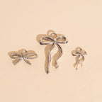 Dainty Bow Huggie Hoop Charms by Oh Clementine