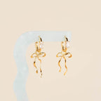 Dainty Bow Huggie Hoop Charms by Oh Clementine