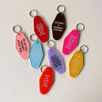Department of Redundancy Department Motel Style Keychain in Black by The Bullish Store
