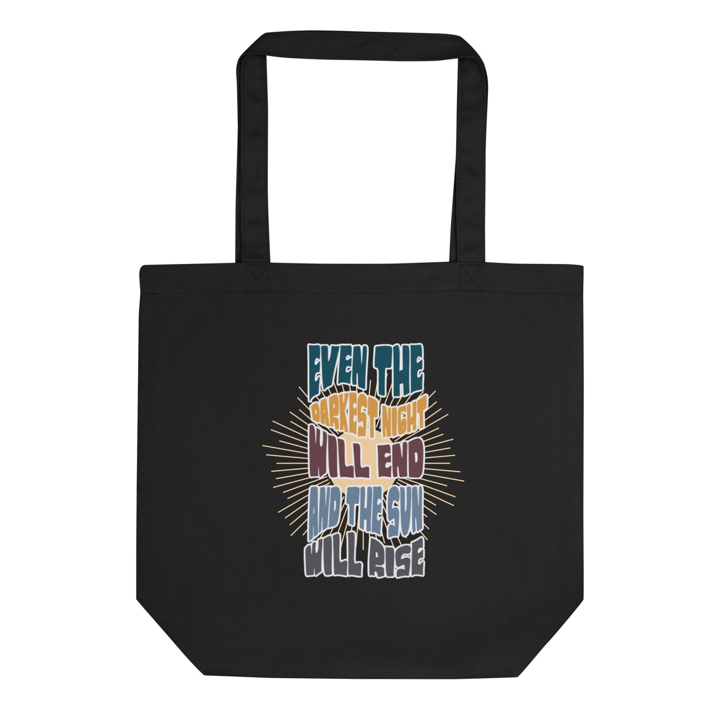 A black canvas tote bag featuring an inspirational quote in colorful, stylized typography with radiating yellow lines in the background. The text reads "EVEN THE DARKEST NIGHT WILL END AND THE SUN WILL RISE" with each phrase in a different color - blue, orange, purple, and light blue respectively. The bag has two black shoulder straps and a spacious rectangular shape.
