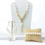Empowering pearl and gold chain y necklace with tassel detail by Alegria Accessories Inc