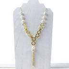 Empowering pearl and gold chain y necklace with tassel detail by Alegria Accessories Inc