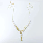 Empowering pearl and gold chain y necklace with tassel detail by Alegria Accessories Inc