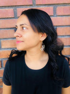 Flourish gold earrings by Alegria Accessories Inc