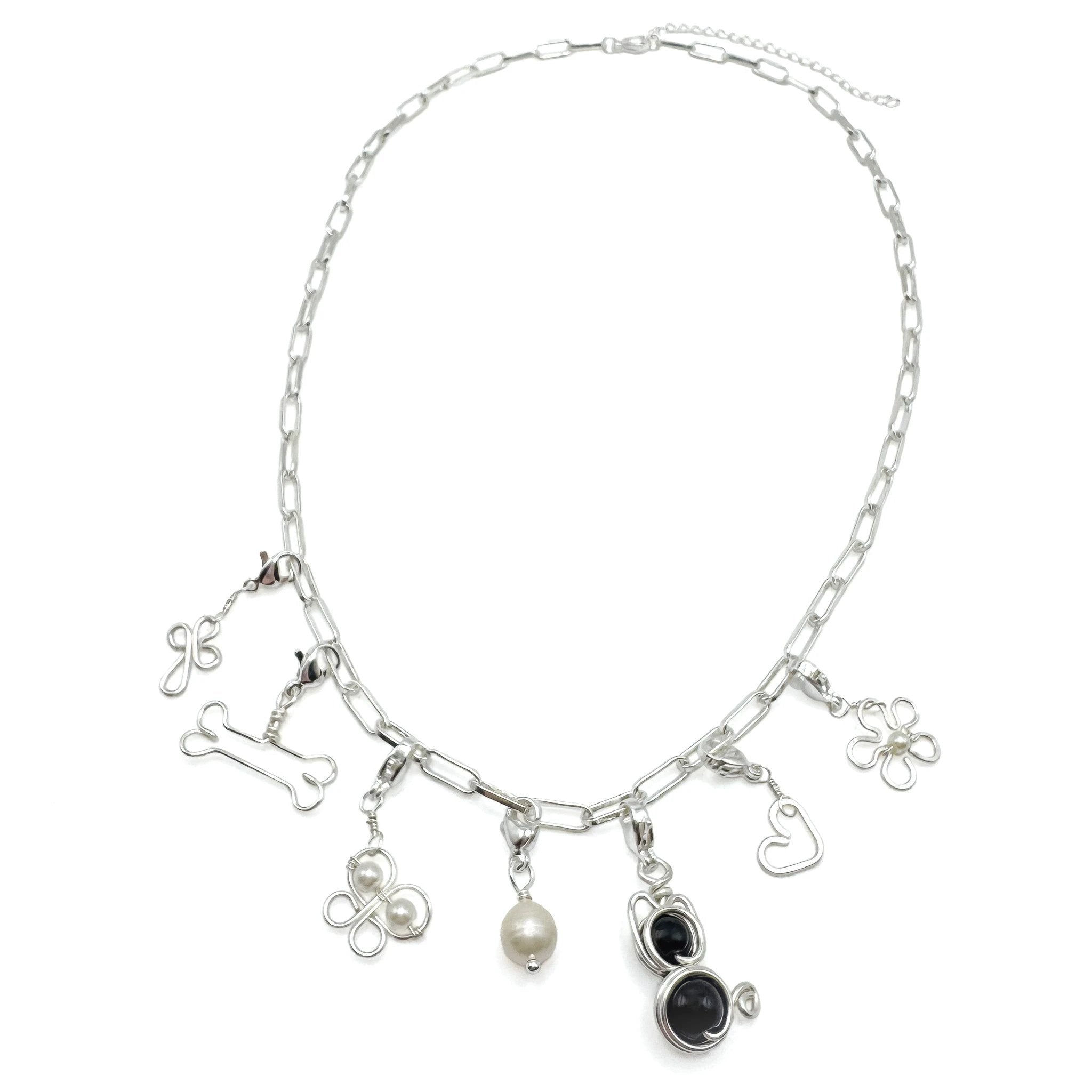 Flower silver charm by Alegria Accessories Inc