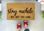 Funny Doormat - Stay Awhile But Not Too Long by Nickel Designs Custom Doormats