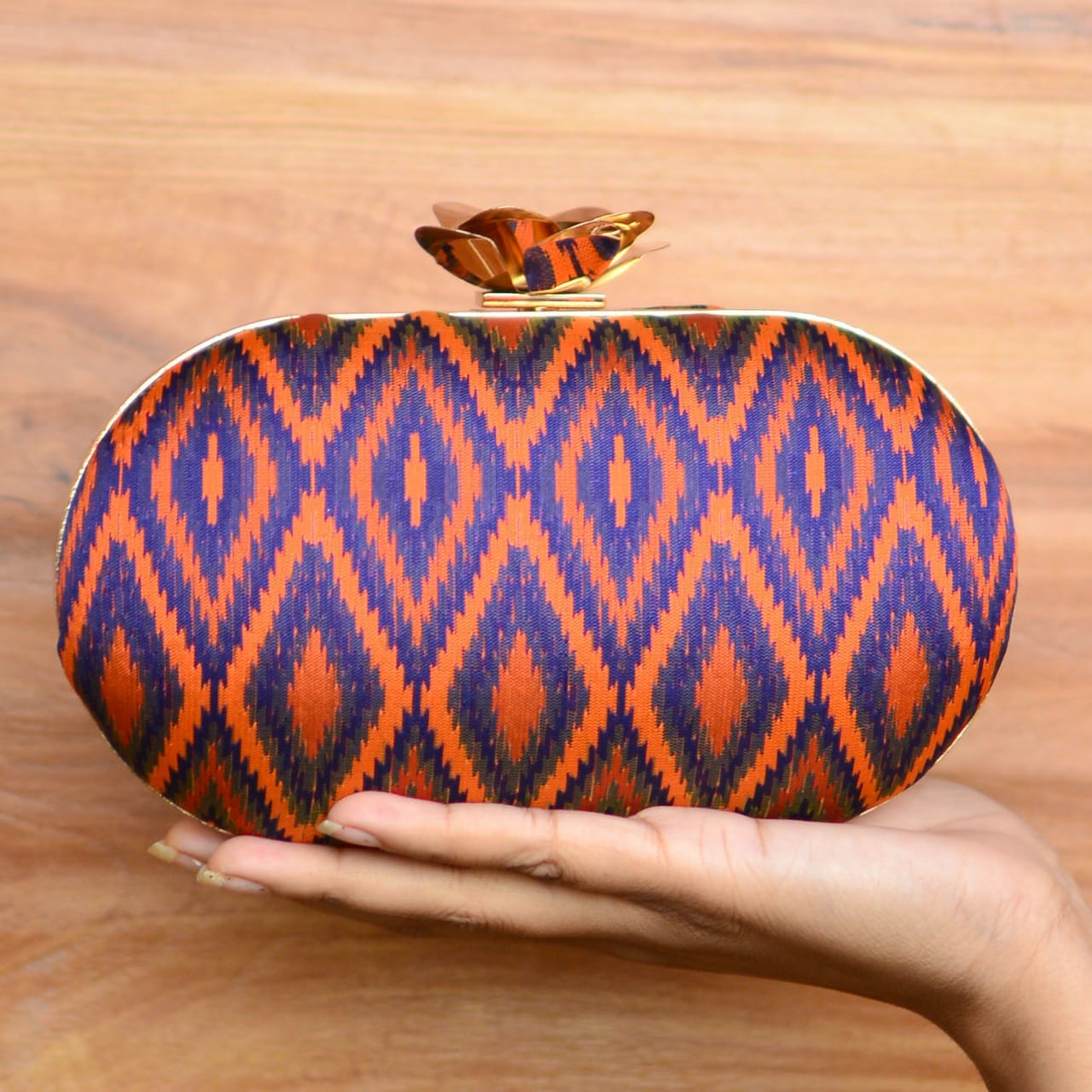Geometric Pattern Fabric Cylindrical Shape Clutch with Designer Floral Knob La Vie Bien Geometric Pattern Fabric Cylindrical Shape Clutch with Designer Floral Knob