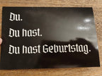 German Birthday Gift Box | Funny German Gift Set | Auf Deutsch Bitte Tee + Nein Dad Hat + Du Hast Geburtstag Card Bundle Gift Sets La Vie Bien German Birthday Gift Box | Funny German Gift Set | Auf Deutsch Bitte Tee + Nein Dad Hat + Du Hast Geburtstag Card