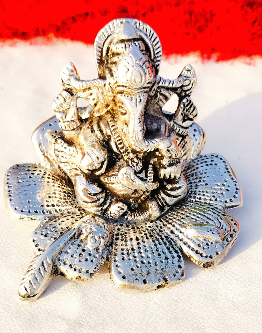 German Silver Ganesh Idol Sitting on Hibiscus Flower La Vie Bien German Silver Ganesh Idol Sitting on Hibiscus Flower