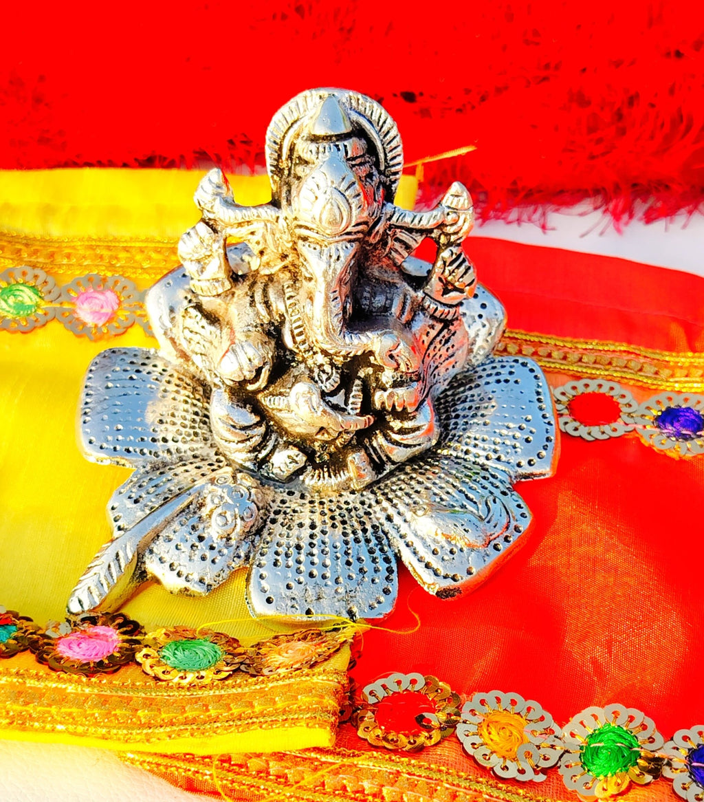 German Silver Ganesh Idol Sitting on Hibiscus Flower La Vie Bien German Silver Ganesh Idol Sitting on Hibiscus Flower
