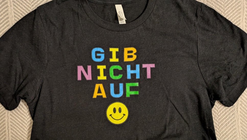 Gib nicht auf (don't give up) German happy face Unisex t-shirt, bright colorful print T-Shirt La Vie Bien Gib nicht auf (don't give up) German happy face Unisex t-shirt, bright colorful print