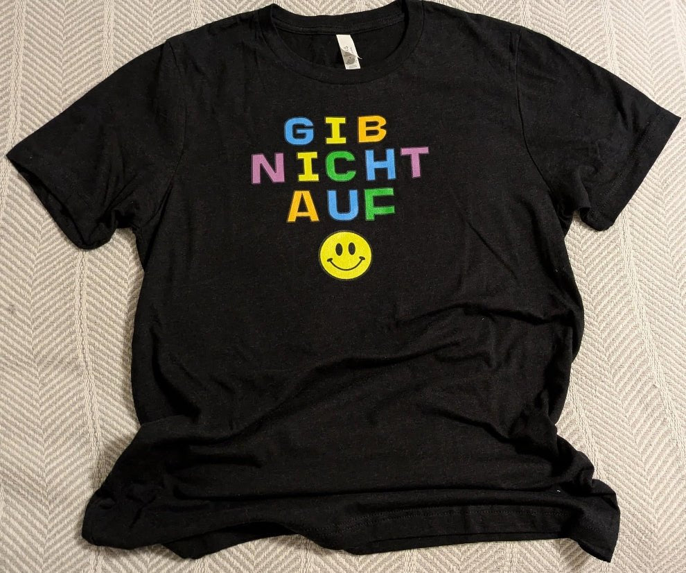 Gib nicht auf (don't give up) German happy face Unisex t-shirt, bright colorful print T-Shirt La Vie Bien Gib nicht auf (don't give up) German happy face Unisex t-shirt, bright colorful print