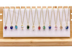 Gold Birthstone necklace by Alegria Accessories Inc