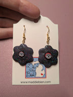 Handmade Sparkly Eye Dangle Earrings: Purple Black Flower, Gold Hardware Earrings La Vie Bien Handmade Sparkly Eye Dangle Earrings: Purple Black Flower, Gold Hardware