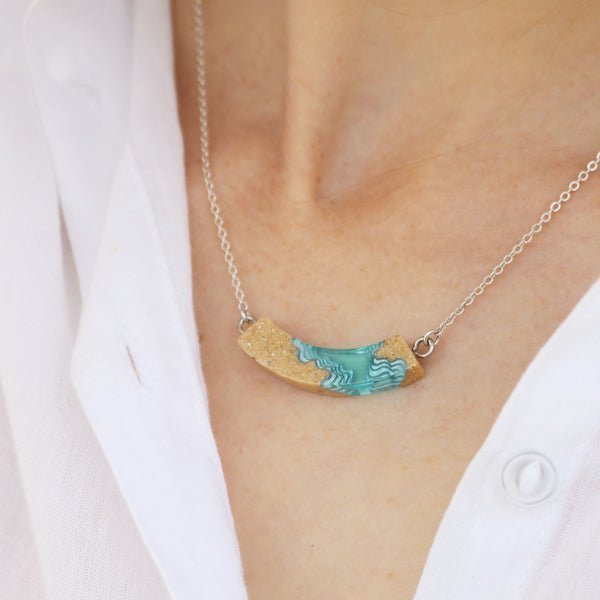 Headland Necklace – Aqua Resin & Sand Arc Pendant La Vie Bien Headland Necklace – Aqua Resin & Sand Arc Pendant