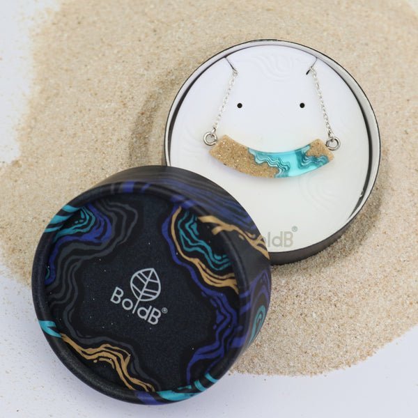 Headland Necklace – Aqua Resin & Sand Arc Pendant La Vie Bien Headland Necklace – Aqua Resin & Sand Arc Pendant