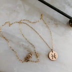 Astrology Hand Stamped Coin Necklace by Derive Jewelry