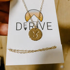 Astrology Hand Stamped Coin Necklace by Derive Jewelry