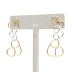 Intertwined gold and silver two-tone heart post earrings by Alegria Accessories Inc
