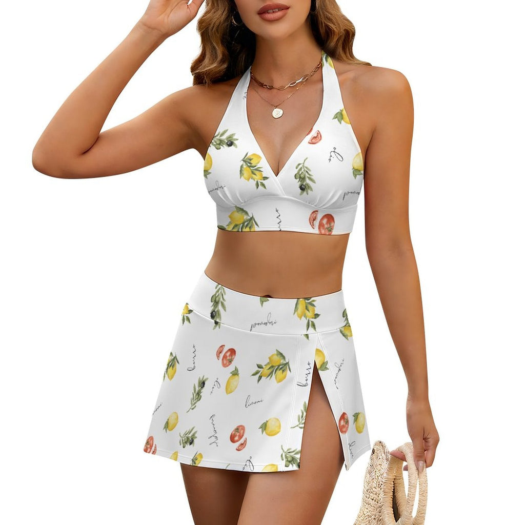 Woman wearing a white bikini set with fruit print on a white background