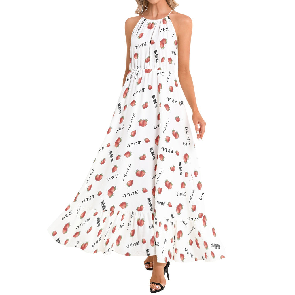 A woman modeling a sleeveless halter-neck maxi dress with an allover print of red lips and black Japanese katakana text on a white background, paired with black heeled sandals.