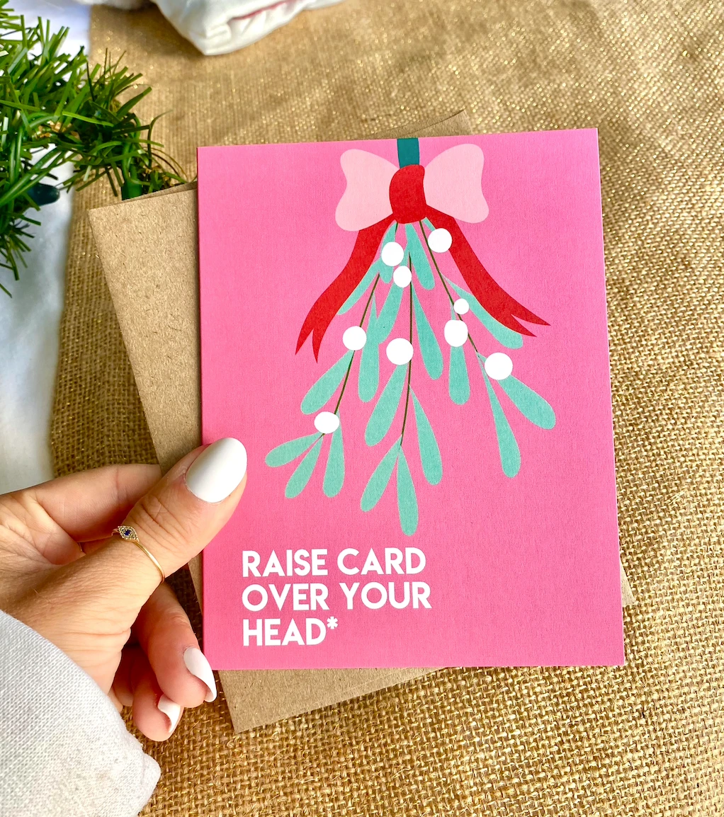 Mistletoe Raise Card Over Your Head Funny Christmas Card by Five Dot Post