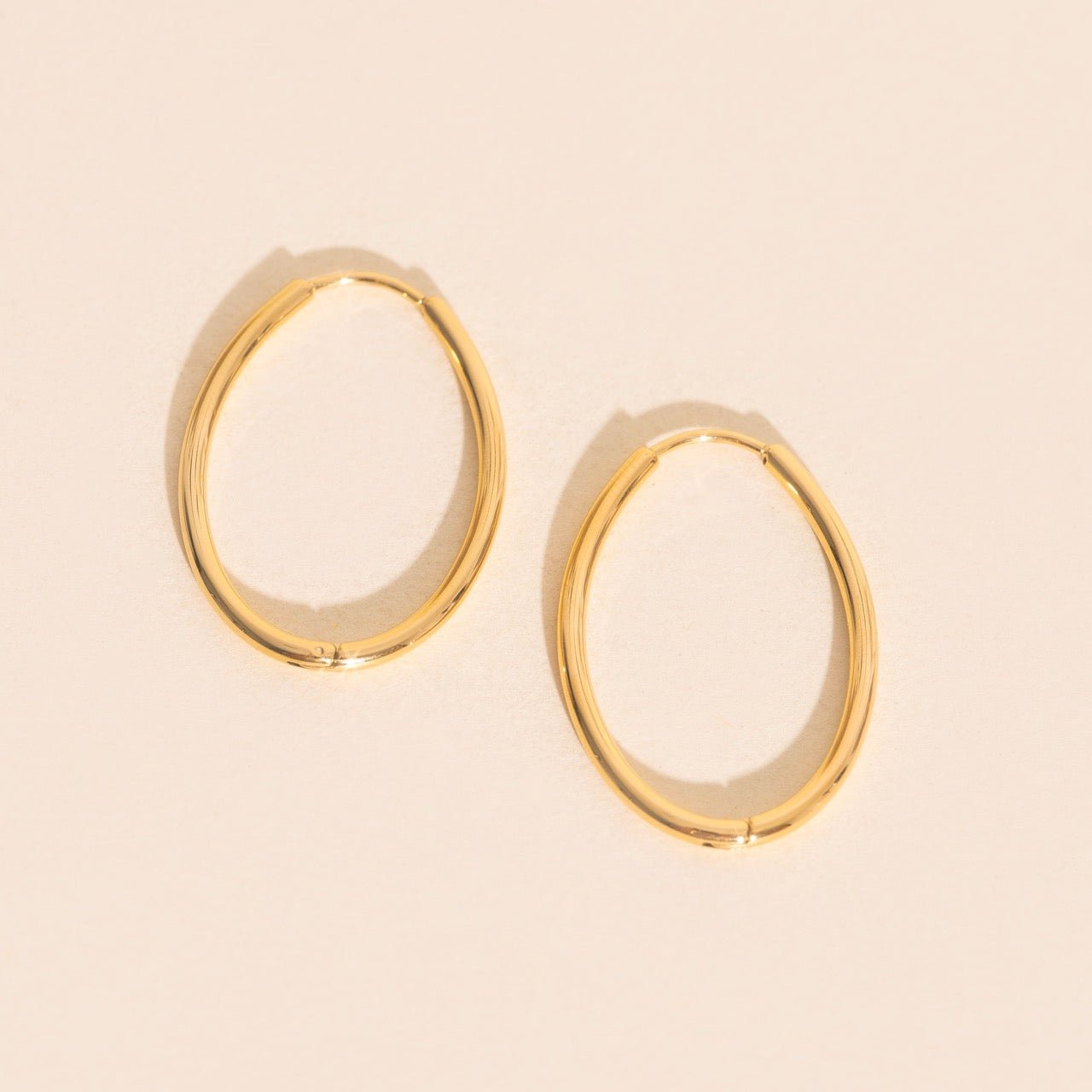 Oval Rounded Huggie Hoop Earrings by Oh Clementine