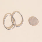 Oval Rounded Huggie Hoop Earrings by Oh Clementine