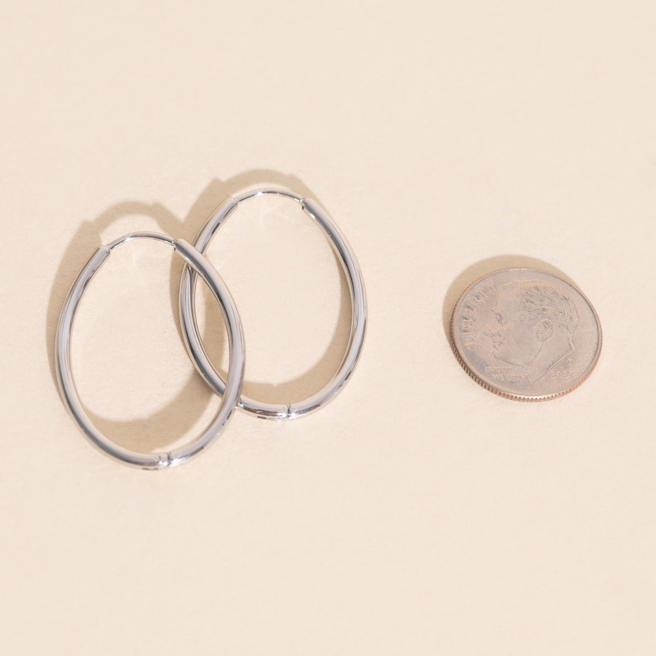 Oval Rounded Huggie Hoop Earrings by Oh Clementine