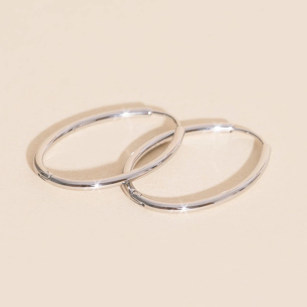 Oval Rounded Huggie Hoop Earrings by Oh Clementine