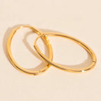 Oval Rounded Huggie Hoop Earrings by Oh Clementine