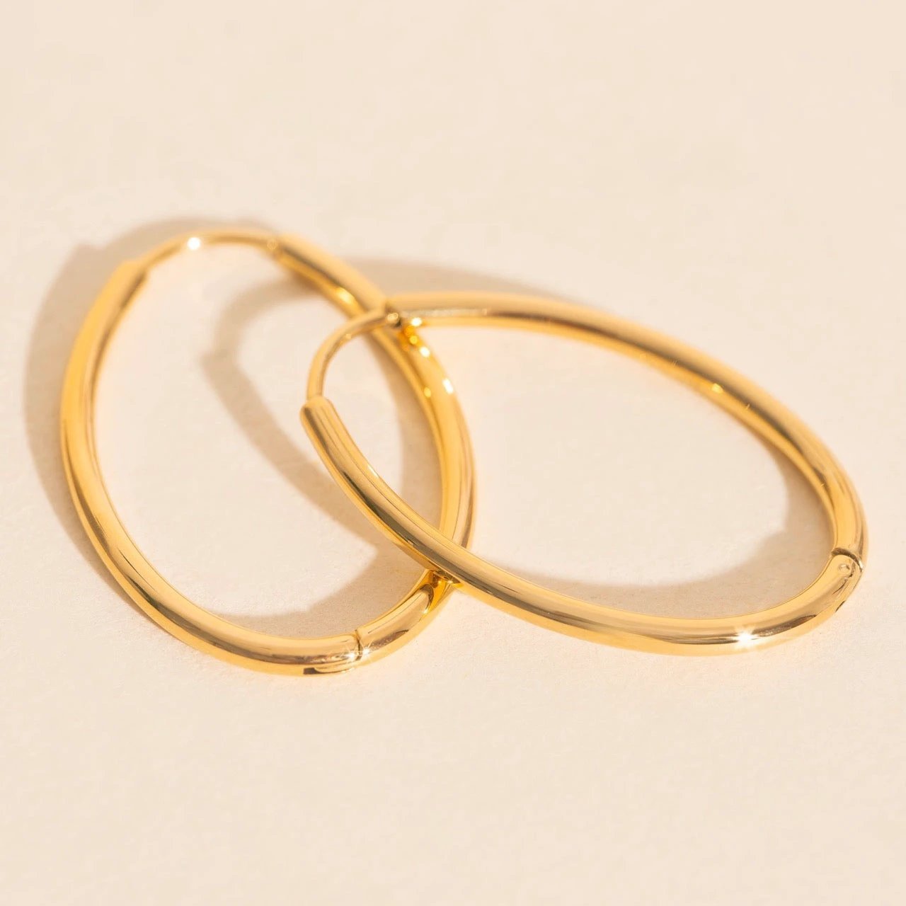 Oval Rounded Huggie Hoop Earrings by Oh Clementine