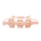 Peach Blossom peach and gold flower crystal adjustable bracelet by Alegria Accessories Inc