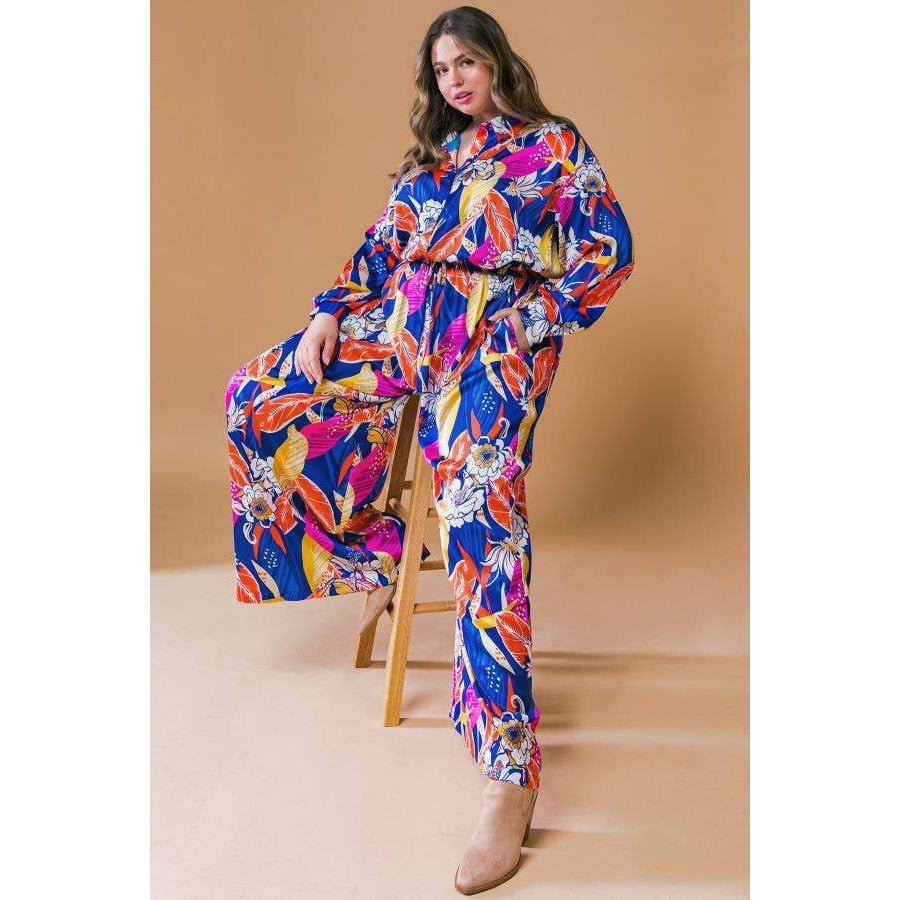 Plus Size Printed Woven Jumpsuit in Blue with Flowers And Leaf Designs | Long Sleeve Romper [Sizes 1X - 3X]