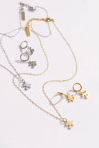 Puzzle Piece Huggie Hoops by Rose & Clay