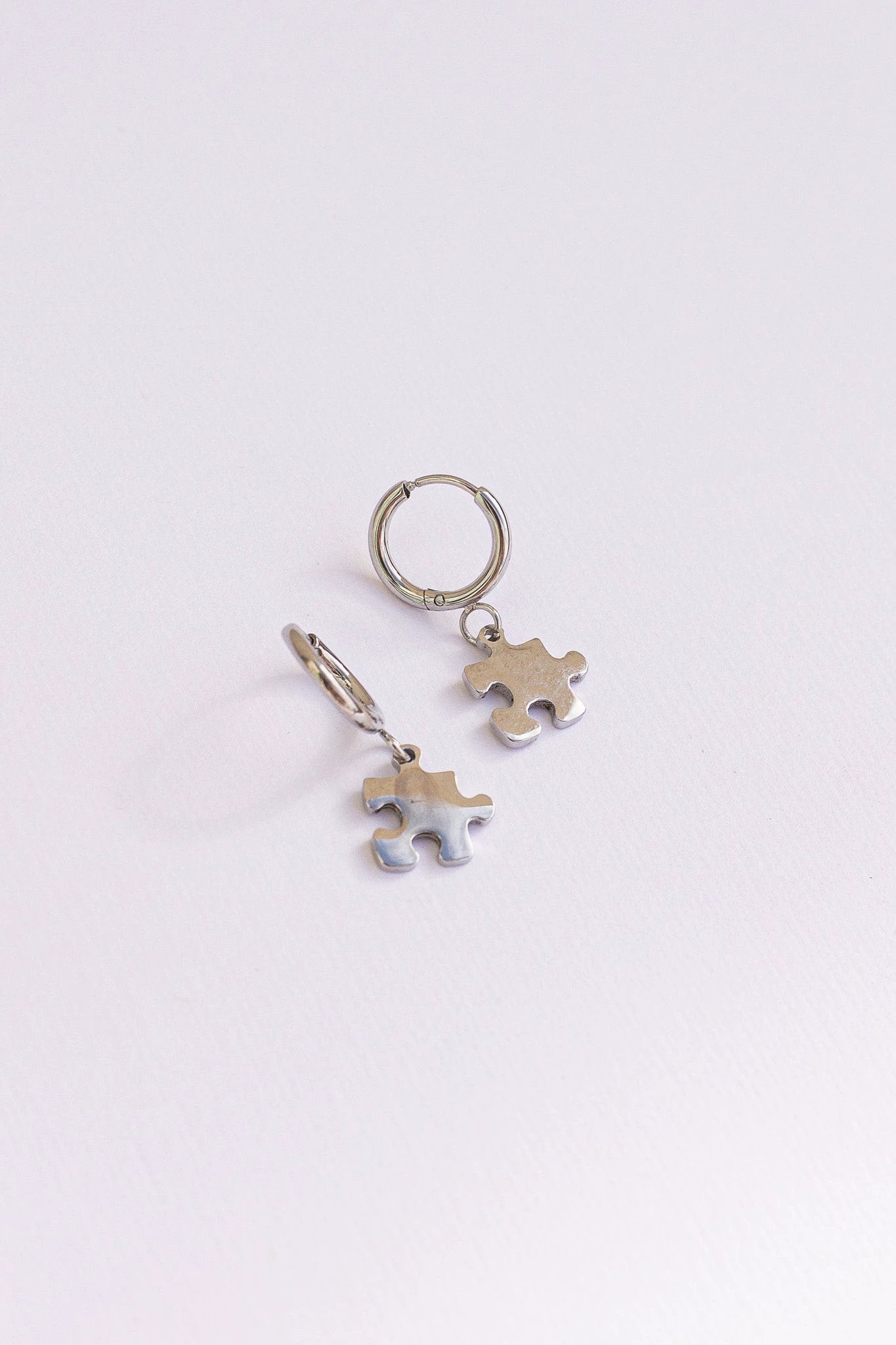 Puzzle Piece Huggie Hoops by Rose & Clay